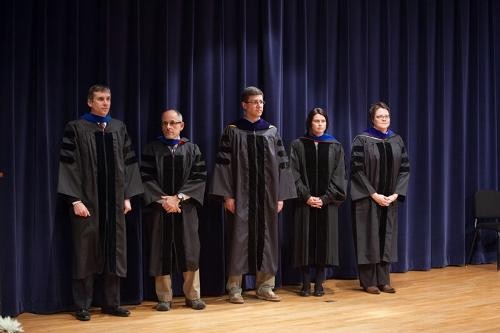 Group of faculty wait their turn to be recognized during convocation